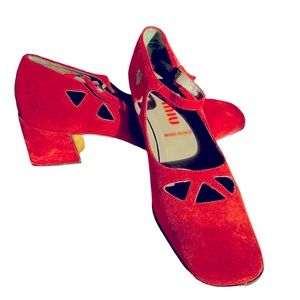 Miu Miu by Prada. NWOT.  Reddish brown suede Mary Janes with lazer cut outs.